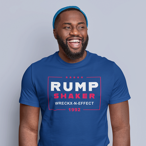 A man smiling and wearing a blue ROCKaBLOCK graphic tee with the text 'RUMP SHAKER WRECKX-N-EFFECT 1992' printed on the front.