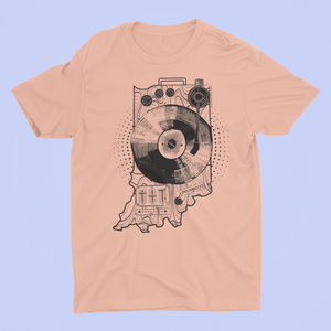 A dusty rose colored ROCKaBLOCK T-shirt with a graphic design resembling a record player and the shape of Indiana state. The T-shirt has text and numerical elements on it.