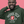 Load image into Gallery viewer, Man wearing a green hoodie with &#39;Arsenal Tech&#39; logo on a pink background
