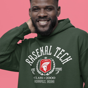 Man wearing a green hoodie with 'Arsenal Tech' logo on a pink background