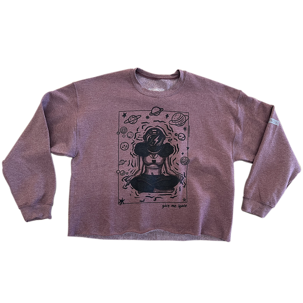 ROCKaBLOCK “Give Me Space” raw hem crewneck sweatshirt in mauve, featuring a bold black illustration of a meditating woman in an astronaut helmet surrounded by planets and stars.