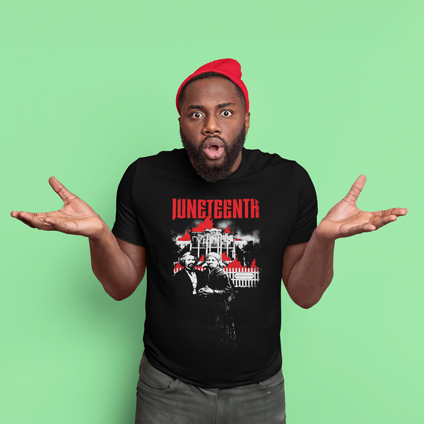 A Man with red beenie wearing a ROCKaBLOCK Juneteenth "Let it burn" graphic t-shirt featuring the Nottoway Plantation burning with Frederick Douglass and Harriet Tubman in front