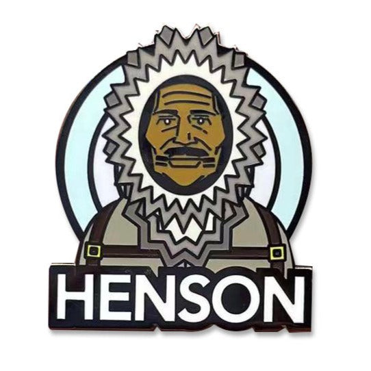 ROCKaBLOCK hard enamel Pioneers pins with characters including Bessie Coleman, Bass Reeves, 'Stagecoach' Mary Fields, Jean Baptiste Point Du Sable, Mary Seacole, and Matthew Henson, secured on a denim fabric. Highlighting Black history.