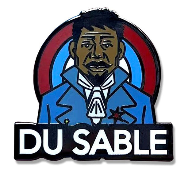 ROCKaBLOCK hard enamel Pioneers pins with characters including Bessie Coleman, Bass Reeves, 'Stagecoach' Mary Fields, Jean Baptiste Point Du Sable, Mary Seacole, and Matthew Henson, secured on a denim fabric. Highlighting Black history.