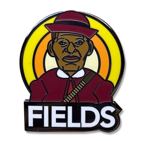 ROCKaBLOCK hard enamel Pioneers pins with characters including Bessie Coleman, Bass Reeves, 'Stagecoach' Mary Fields, Jean Baptiste Point Du Sable, Mary Seacole, and Matthew Henson, secured on a denim fabric. Highlighting Black history.