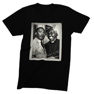 Black t-shirt with a graphic of two men on a white background