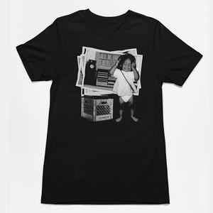 Black t-shirt with a graphic design of a child on a white background