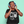 Load image into Gallery viewer, Person wearing blue headphones on a light green background
