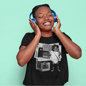 Person wearing blue headphones on a light green background