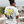 Load image into Gallery viewer, Person wearing a white t-shirt with graphic design, standing on a bridge overlooking a highway.
