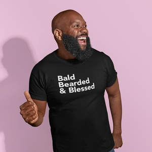 Happy Bald Black man with beard wearing rockablock black t-shirt with phrase bald bearded & blessed on the front